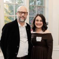 Gloria Masterton Hunter smiles with a supporter before the dinner